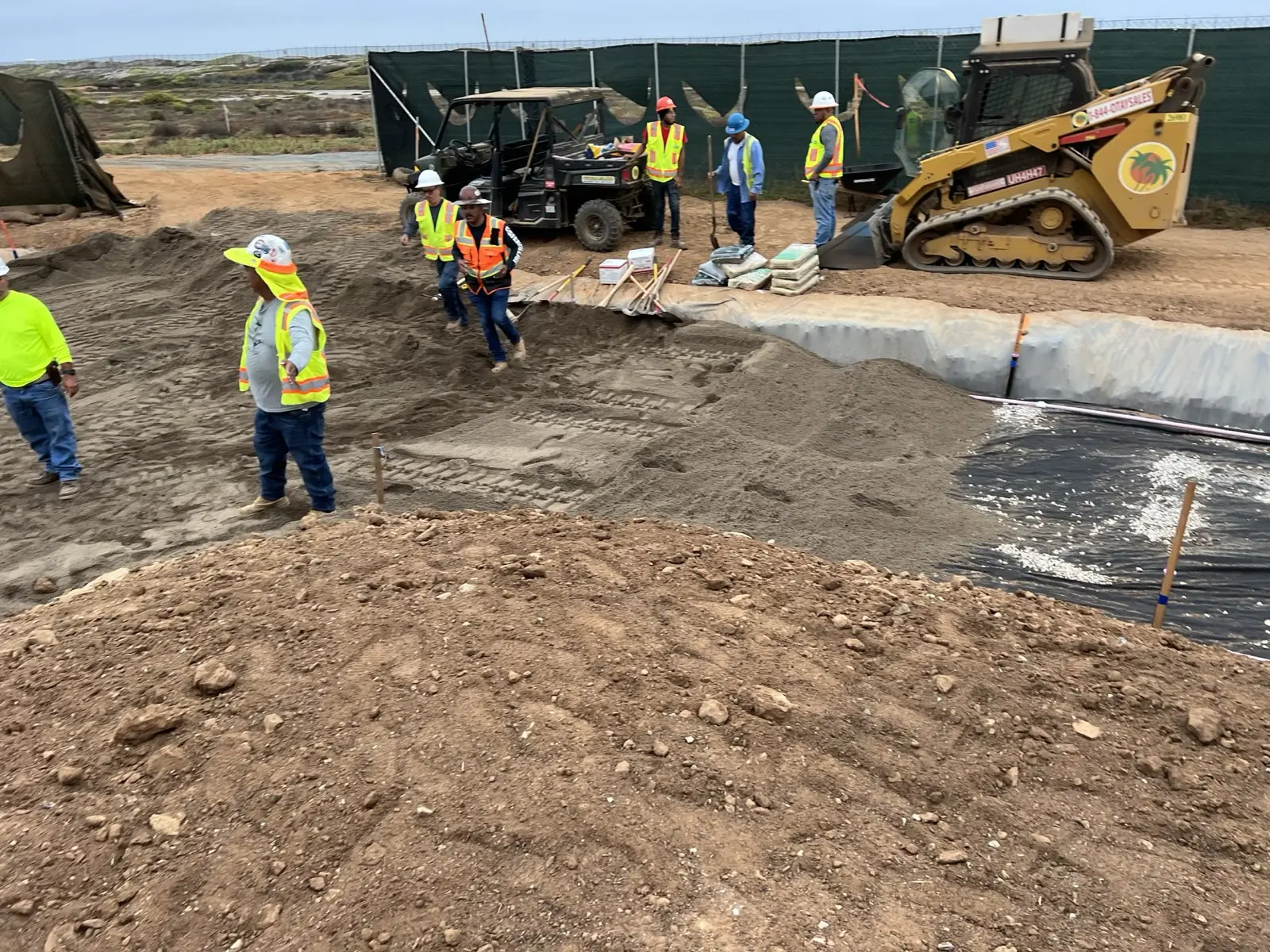 Multi-crew at excavation with skid-steer